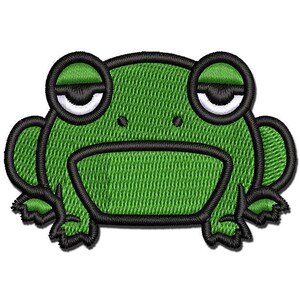 May include: An embroidered patch featuring a green frog face with black outlines. The frog has large, sleepy eyes with white sclera and black pupils, two small black nostrils, and a wide, flat mouth. The design is stitched with green thread.