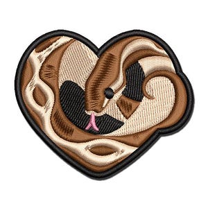 May include: A heart-shaped embroidered patch featuring a brown and cream snake coiled into a heart silhouette. The snake has a small black eye and a pink forked tongue, with a thick black stitched border outlining the entire heart shape.