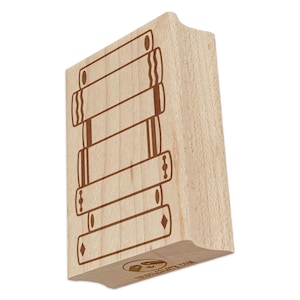 May include: Wooden rubber stamp with a design of a stack of books. The stamp is made of light wood and has a brown ink pad. The design is simple and elegant, and the stamp is perfect for adding a touch of whimsy to your crafting projects.