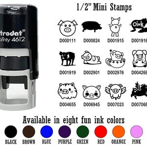 May include: A black and gray self-inking stamp with the text "trodat printy 4612" on it. The stamp is 1/2 inch in size and is available in eight different ink colors: black, brown, blue, purple, green, red, orange, and pink. The stamp features a variety of pig designs, including a pig with wings, a pig with a crown, and a pig with a heart.
