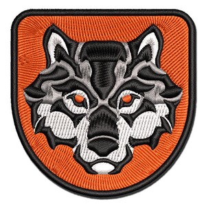 May include: An embroidered patch featuring a wolf's head in gray, black, and white, with orange eyes. The wolf's head is centered on a bright orange background with a black outline.