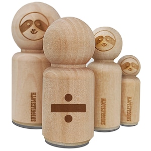 May include: A collection of wooden stamps featuring a sloth design and a division symbol. The stamps are various sizes and have the text "SNIGGLESLOTH" on the sides. The sloth's face is etched into the top of each stamp.