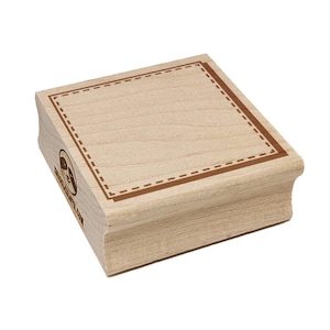 May include: A wooden stamp with a square border design. The stamp has a light brown color with a darker brown border and dashed lines. The stamp has the text "www.etsy.com" on the side.