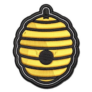 May include: A yellow and black embroidered beehive patch. The beehive is outlined in black and has a white outline around the black border.