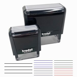 May include: Two black self-inking stamps with the text "trodat printy 4713" and "trodat printy 4711" on them.