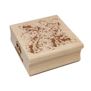 May include: A rectangular wooden stamp with a brown, textured design on the top surface. The stamp has rounded edges and a logo with text on the side. The stamp is made of light-colored wood.