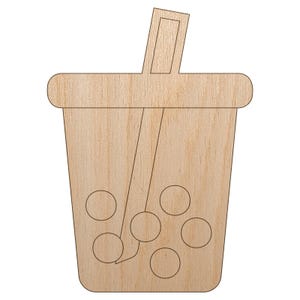 May include: A wooden cutout of a bubble tea drink with a straw. The drink has a rectangular handle and a rounded top. Several circles represent the tapioca pearls at the bottom of the cup. The wood has a light brown color.
