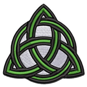 May include: A green and black Celtic knot design, also known as a Trinity knot, is a symbol of interconnectedness and eternity. The knot is made of three continuous loops that are interwoven together.