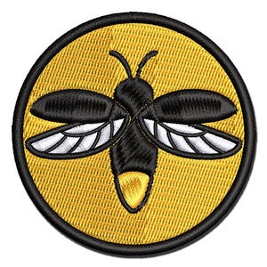 May include: A circular embroidered patch featuring a black firefly with white-accented wings centered on a vibrant yellow background. The insect has a glowing yellow tail segment and is framed by a thick, solid black stitched border edge.