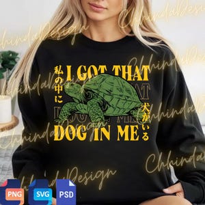 May include: Black sweatshirt with a green turtle graphic and yellow text that reads "I GOT THAT DOG IN ME" with Japanese characters. The design includes a turtle illustration.