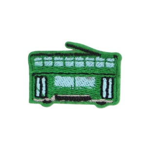 May include: Embroidered patch of a green double-decker bus with light blue windows and black accents. The patch is a detailed representation of a classic bus, perfect for adding to clothing or accessories.