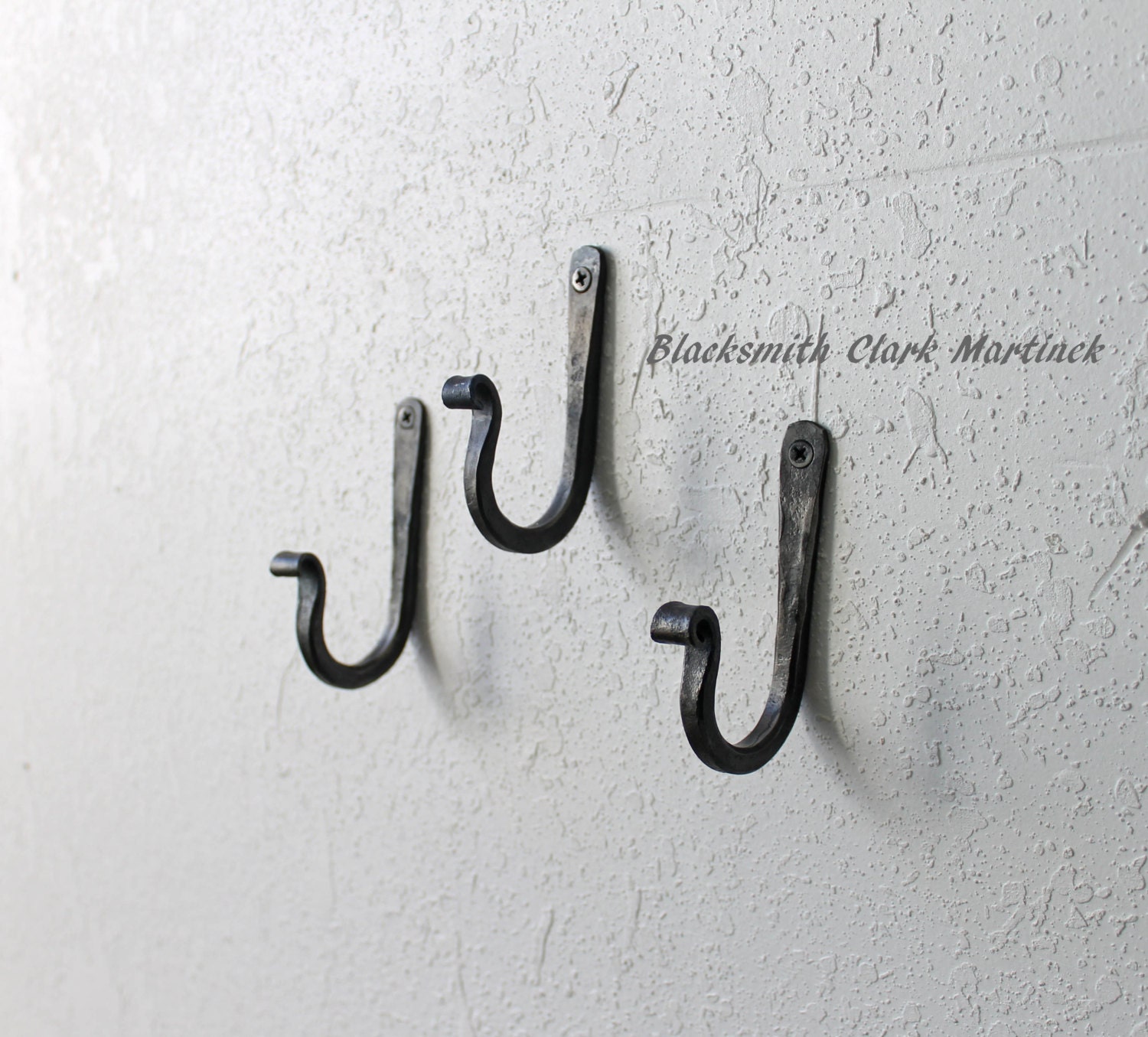 7 Decorative Cast-Iron Triple Hook with Black-Powder Coat. 7 Decorative Cast-Iron Triple Hook with Black-Powder Coat.
