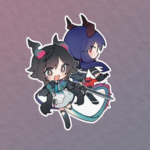 May include: A die-cut sticker featuring two chibi-style anime characters with dark hair and horns. The front character has black hair with pink accents, wearing a teal and white outfit, holding a sword. The back character has dark blue hair.