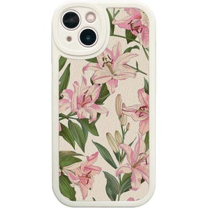 May include: White phone case with a floral design featuring pink lilies on a cream background. The case has a raised camera bump with a black camera lens.