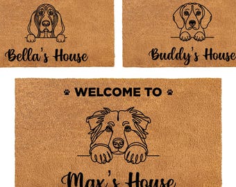 May include: Five rectangular doormats with dog illustrations and the text "Welcome To". Each mat features a different dog breed and a personalized name: Lucy's, Charlie's, Bella's, Buddy's, and Max's House. The mats are brown.