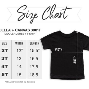 May include: Black toddler jersey t-shirt with a size chart. The chart shows measurements for sizes 2T to 5T, with widths from 30.5cm to 38.1cm and lengths from 39.4cm to 47cm. The text "Size Chart" is at the top.