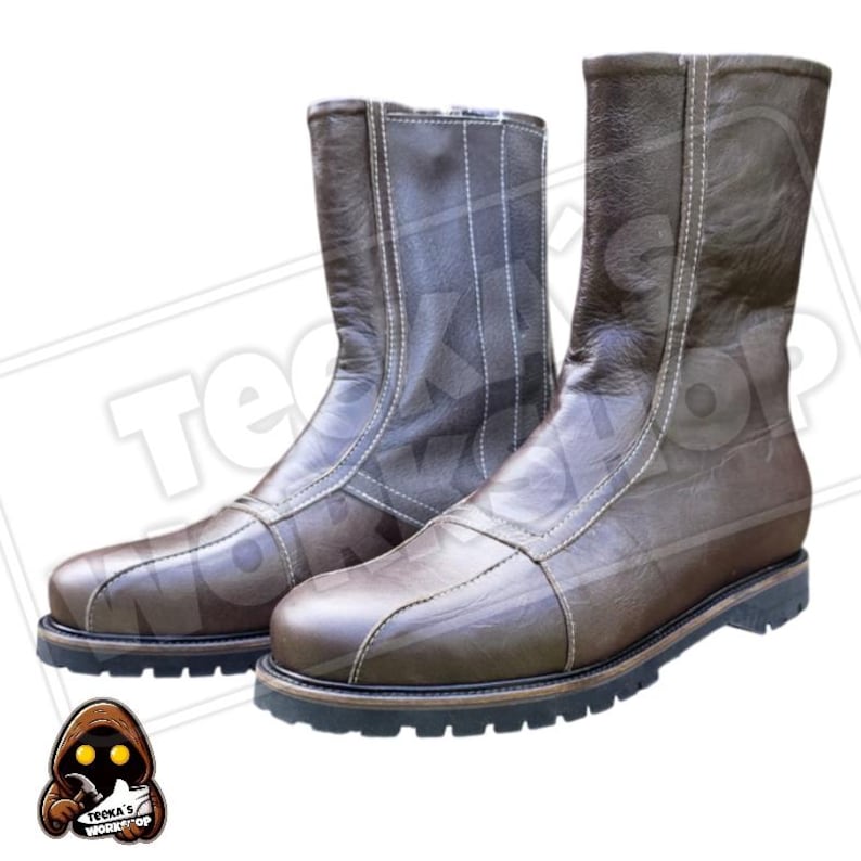 May include: A pair of brown leather boots with a zip closure and white stitching. The boots have a round toe and a black sole. The boots are approximately mid-calf height.