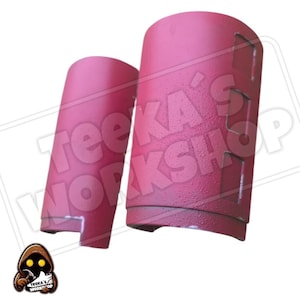 May include: A set of three ceramic vases in varying heights and shapes. The vases are glazed in a matte white finish, offering a minimalist aesthetic. The tallest vase is approximately 10 inches high.
