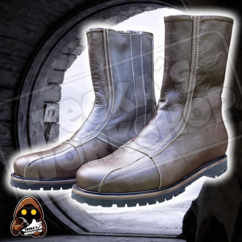 May include: A pair of brown leather boots with white stitching and a black sole. The boots are mid-calf length and have a zip closure. The boots are set against a blurred background.