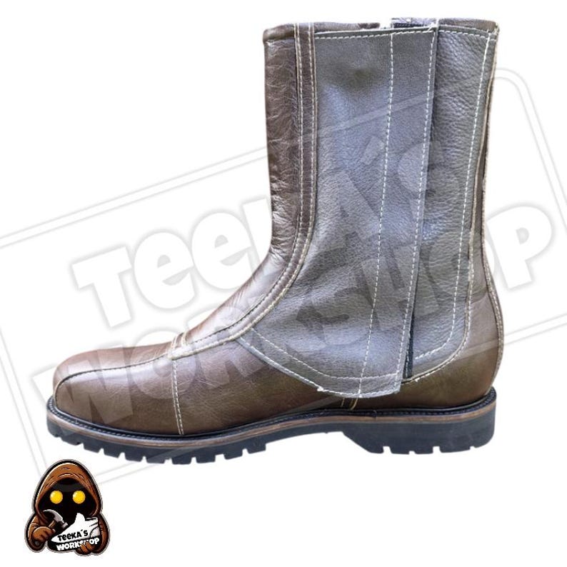 May include: Brown leather boot with a side zip and white stitching. The boot has a rounded toe and a thick, black sole. The boot is approximately 20 cm tall.