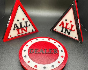 May include: Three red and black poker chips with white accents. One chip says "DEALER" in black letters. The other two chips are triangular and say "ALL IN" in black and red letters.