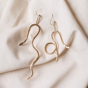Mismatched Statement Snake Dangles. Brass earrings. Long Snake Dangles. Statement Earrings. Gold fill hooks.