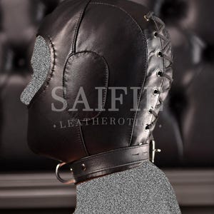 May include: Black leather hood with eye and nose cutouts, a neck collar, and a lace-up back. The hood has the text "SAIFII LEATHEROTIC".