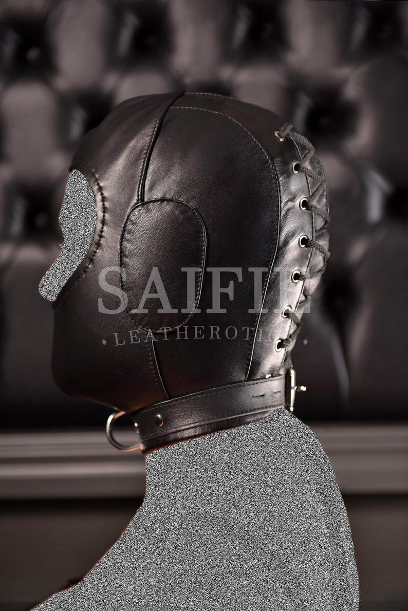 May include: Black leather hood with eye and nose cutouts, a neck collar, and a lace-up back. The hood has the text "SAIFII LEATHEROTIC".