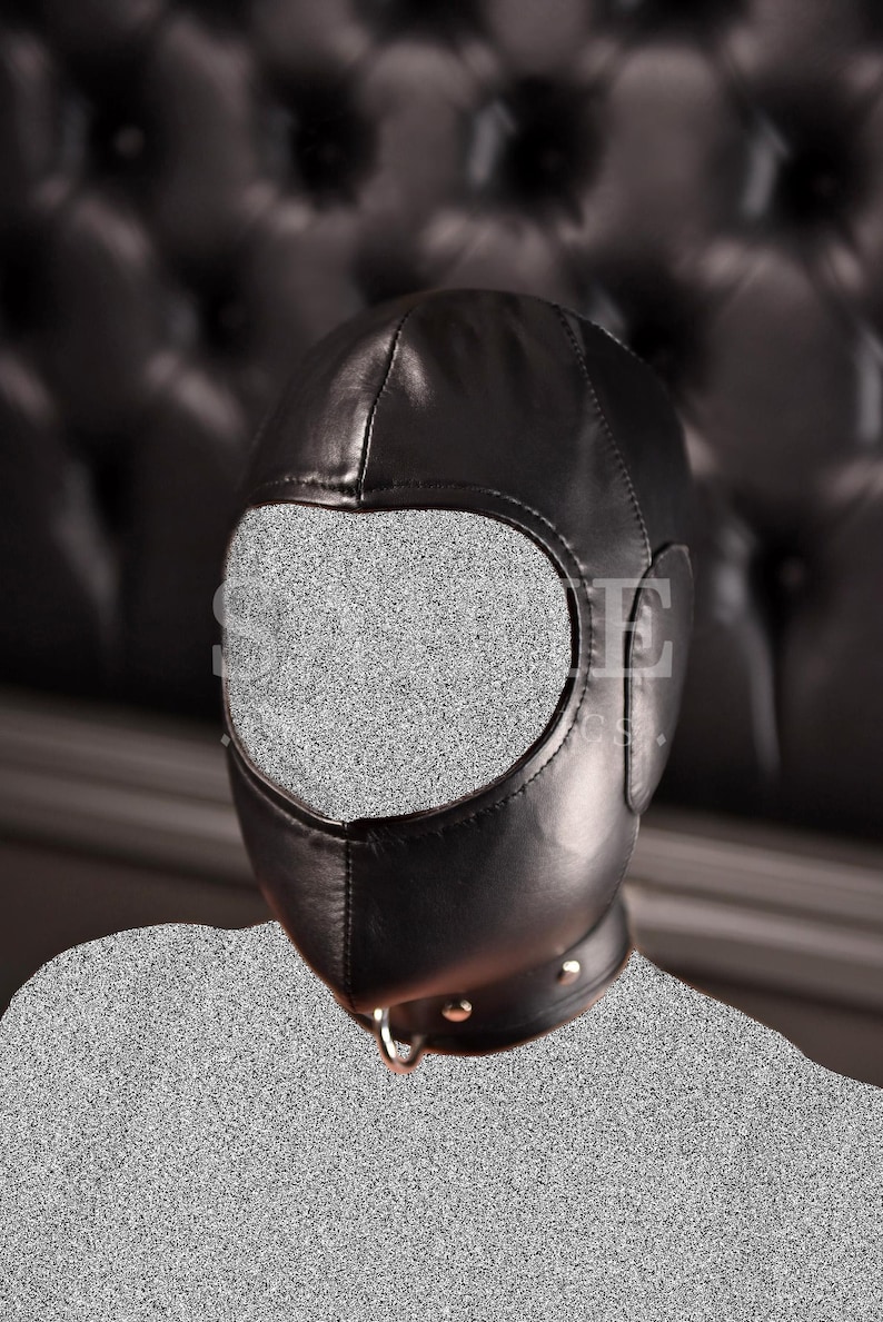 May include: A black leather hood with a large eye opening and a neck collar. The hood has a smooth texture and is designed to cover the entire head. The word "SAIFIE" is visible on the front of the hood.