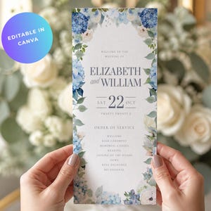 May include: A vertical wedding order of service card featuring a watercolour floral border of blue hydrangeas and white roses. The text reads: Welcome to the wedding of Elizabeth and William, Sat 22 Oct, Twenty Twenty X, and Order of Service.