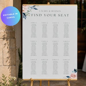 May include: A wedding seating chart sign on a gold easel featuring the text Laurel & Hudson Find Your Seat, organized into twelve tables with lists of names, decorated with watercolor floral illustrations in shades of pink and dark blue.