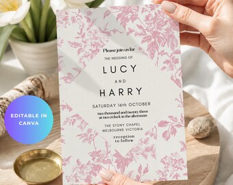 Puede incluir: Una tarjeta de invitación de boda rectangular con un panel central blanco con texto en negro y un patrón floral rosa tipo toile en los bordes. El texto dice: Please join us for the wedding of Lucy and Harry, Saturday 16th October, two thousand and twenty three at two o'clock in the afternoon, The Stony Chapel Melbourne Victoria, reception to follow.