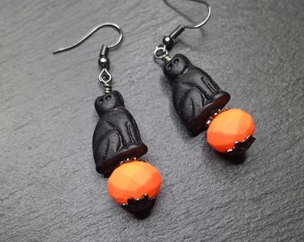 Czech glass Black cat on a neon orange pumpkin earrings with rubberized crystal and gunmetal ear wires