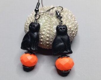 Czech glass Black cat on a neon orange pumpkin earrings with rubberized crystal and gunmetal ear wires