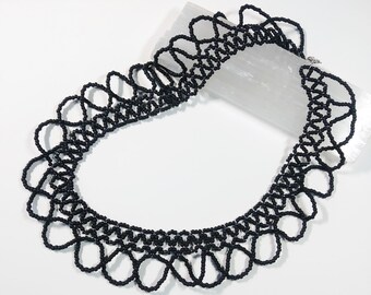 Black, lacy seed bead netted collar necklace with hematite colored seed bead accents, 15.75 - 17.75" long adjustable choker