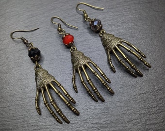 One pair of skeleton hand and crystal earrings, choice of 3 colors black red and dark topaz