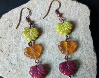 Falling leaves earrings made with copper findings and yellow, orange, and red pressed glass leaves, perfect for the fall season