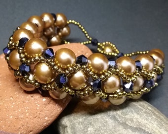 Golden pearl bracelet with black crystals and gold seed beads