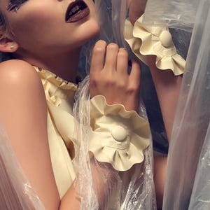 Latex clothing Felice cuffs in White.
