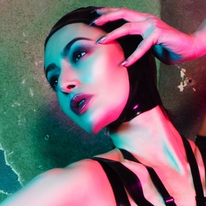 Latex clothing Black open face hood. Fashion accessories.