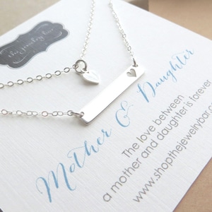 mother daughter bar necklace with heart cutouts set.