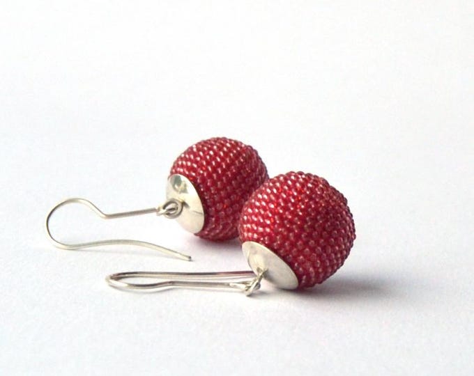 globe ear dangles salmon coloured