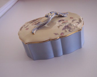 A sky blue trinket glass box