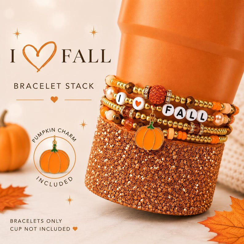 May include: A stack of beaded bracelets featuring gold-tone beads, orange accents, and white letter beads spelling I HEART FALL. The stack includes a dangling orange pumpkin charm. Text on the image reads I HEART FALL BRACELET STACK.
