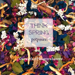 May include: A close-up of a colorful potpourri mix with dried flowers, leaves, and citrus peels. The text "Think Spring potpourri" is superimposed on the image.