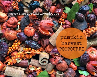 May include: A close-up of a potpourri mix with cinnamon sticks, dried berries, and small orange pumpkins. The text "pumpkin harvest POTPOURRI" is in an orange circle. The shop name "crowsnest primitiveshoppe" is in the upper left corner.