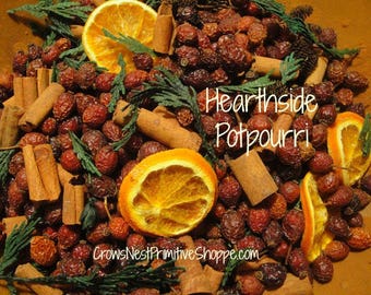 Hearthside Potpourri blended with rosehips, berries, spices, cinnamon, greens, cedar, organic sliced oranges, scented your choice fragrance