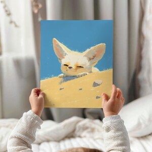 May include: A white fennec fox with large ears peeks over the edge of a sand dune. The fox has a light blue sky in the background.