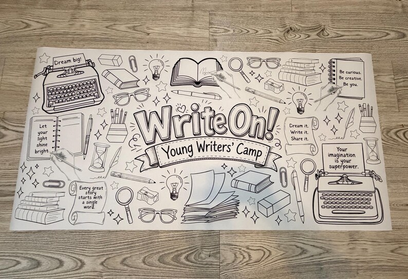 May include: A large white rectangular coloring poster featuring black line art illustrations of typewriters, books, glasses, lightbulbs, and pens. The central text reads "Write On! Young Writers' Camp" with additional motivational phrases like "Dream big!" and "Your imagination is your superpower."