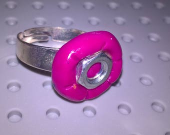 Pink ring with metal nut decoration